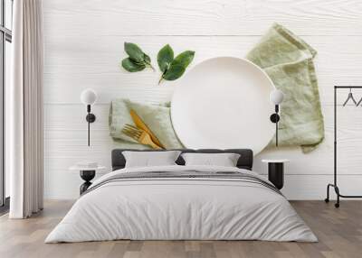 Dinner plate setting with cutlery and napkin. Top view Wall mural