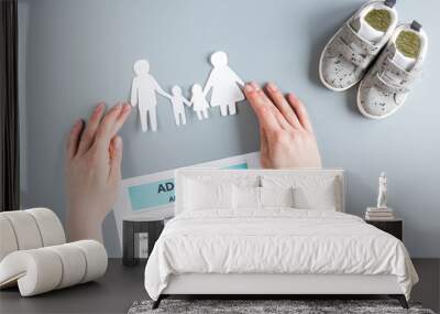 family paper figures in adopting concept on gray background top view Wall mural