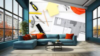 House building plan. Blueprints, instruments, helmet on white wooden background top-down Wall mural