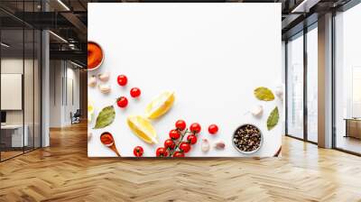 Kitchen frame with spices and food - pepper, garlic, cherry tomatoes - on white background top-down frame copy space Wall mural