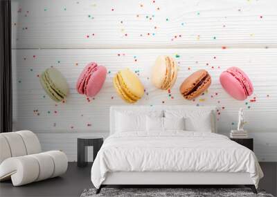 Macarons dessert pattern on white wooden background top view copy space Wall mural