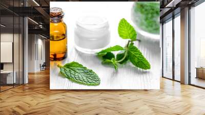 organic cosmetics with herbal extracts of mint on wooden backgro Wall mural