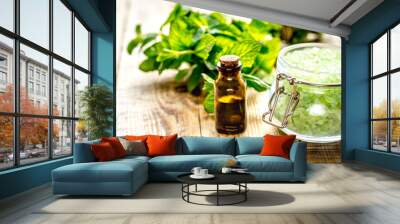 organic cosmetics with herbal extracts of mint on wooden background Wall mural