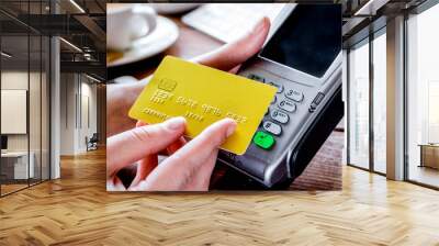 Payment by card in cafe with terminal and keyboard on wooden bac Wall mural