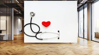 stethoscope on white background with plush heart Wall mural