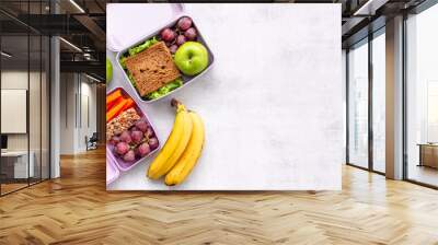 Student meal in purple lunch boxes, top view. Healthy shacks Wall mural