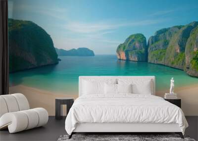 A beautiful beach with a clear blue ocean and mountains in the background Wall mural