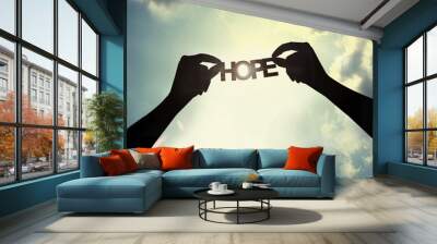 holding paper cut of hope Wall mural