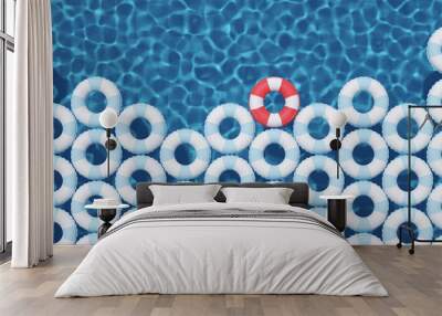 unique red float ring between blue float rings in pool. 3d rendering Wall mural