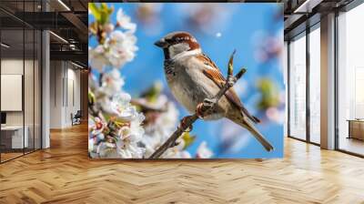 A bird perched on a tree branch Wall mural