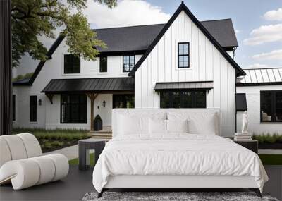 A brand new, white contemporary farmhouse with a dark shingled roof and black windows  Wall mural