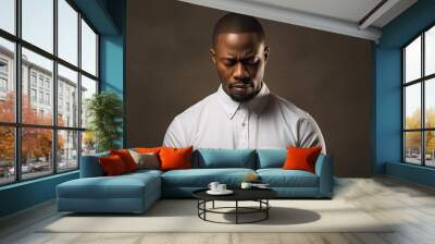 A man from Africa wearing a white shirt prays with faith in the Christian religion Wall mural