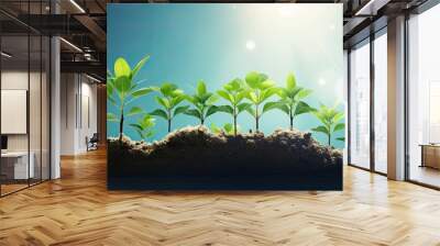 A young green plant is emerging and growing from the brown soil, showing early stages of growth and development Wall mural