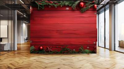 Christmas theme on red wooden surface with garland and decorations Artistic layout with space for text viewed from above Festive Christmas border Wall mural