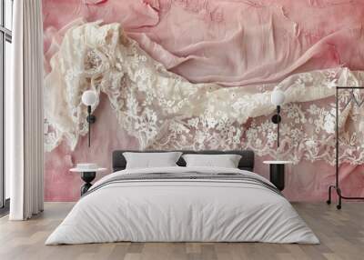 Delicate white lace adorns a textured pink linen tainted with stains Wall mural