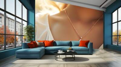 Elegant woman wearing a stunning pendant in soft sunlight Delicate chain with a precious gem Opulent jewelry With copyspace for text Wall mural