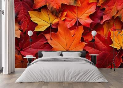 Fallen leaves in vibrant shades of orange and red during the autumn season Wall mural