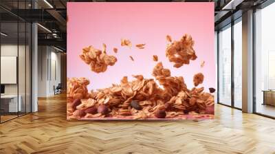 High resolution image of granola flakes floating in zero gravity on a pink backdrop Wall mural