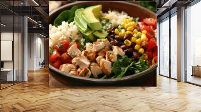 Indulge in a delightful homemade Mexican chicken burrito bowl featuring a mouthwatering combination of rice beans corn tomato avocado and spinach a flavorful taco salad lunch bowl awaits Wall mural