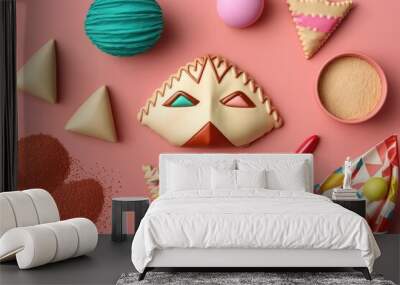 Jewish carnival holiday concept, Purim celebration. Delicious hamantaschen cookies, a bright red carnival mask, a noisemaker, some tasty chocolates, and some party decorations, all on a pastel pink ba Wall mural