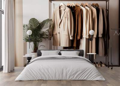 Men's and women's clothing shelves in a shop. On a background of beige and cream colors, there are clothes on a podium on a shelf. Neutral beige clothing collection that is hung on a rack. Generative Wall mural