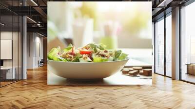 Nutritious office lunch with salad and apple near laptop. Wall mural