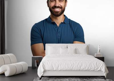 Smiling bearded man in blue polo shirt poses with crossed arms against transparent background Wall mural