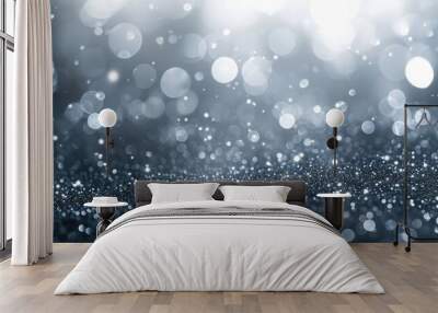 Sparkling silver particles with bokeh creating an abstract background. Festive dust for Christmas and New Year. Wall mural