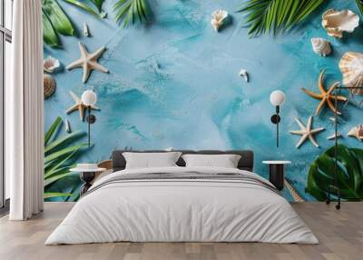 Summer themed modern flat lay composition with tropical elements on blue backdrop symbolizing travel concept Wall mural