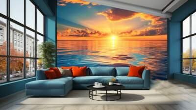 Sunset over water in golden and blue hues. Wall mural