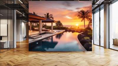 Sunset view of a tropical villa with garden, pool, and open living area. Wall mural