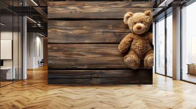 Teddy bear on wooden background with space for text Wall mural