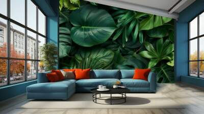 Thick foliage of various lush plants seen up close. Wall mural