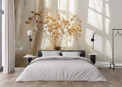 White desk with brown vase of dried autumn flowers sunlit curtains space for text Wall mural