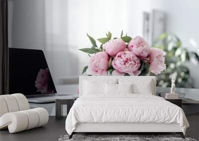 Workspace at an office desk table with a mock up laptop screen. Design of a contemporary, fashionable home including a bunch of pink peonies. social networking, a blog, and a website hero template Wall mural