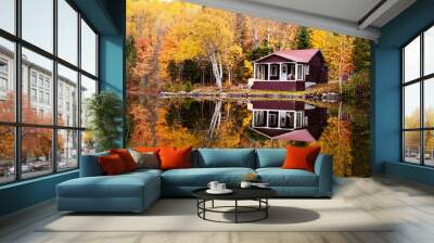 Reflections of a autumn forest and a house in a lake Wall mural