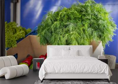 Bunch of fresh green vegetables in grocery store. Healthy lifestyle and organic vegetarian food concept. Bunches of fresh green parsley on the market counter. Wall mural