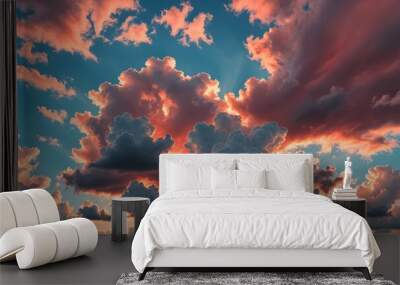 Dreamy big puffy clouds sky of red color in the setting sun. Beautiful landscape blue sky cloud background and Panorama of sky wallpaper Wall mural