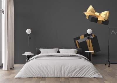 3d rendering. Black Friday. Open gift with a gold bow on a black background. Wall mural