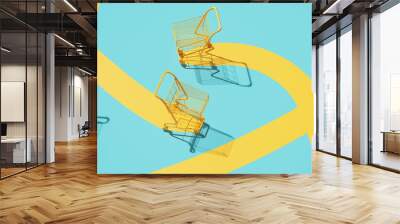 Minimal composition for shopping and supermarket concept. Yellow shopping cart trolley and yellow path on blue background. 3d rendering illustration. Wall mural