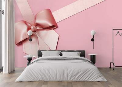 Minimal copy space for Christmas, New year and holiday season. Pink ribbon bow on pink background. 3d render illustration. Clipping path of each element included. Wall mural