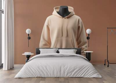 a beige hoodie on a mannequin, isolated on a brown background, front view mockup template Wall mural