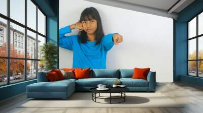 Close-up of a little girl posing on a phone Wall mural