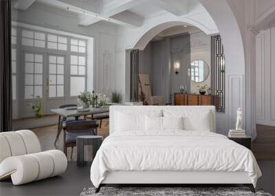 a view of a set dining table in a chic expensive bright interior of a huge living room in a historic mansion with arched arches, columns and white walls decorated with ornaments and stucco. Wall mural