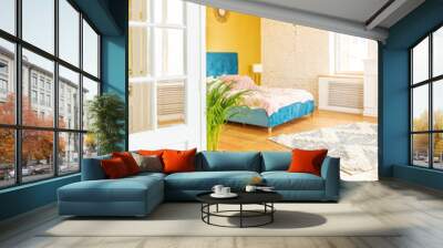 very light and sparcious two-rooms apartment in scandinavian design style with fashion furniture and large windows. warm colors during day time Wall mural