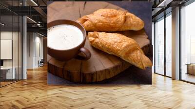 Coffee and two fresh croissants on cutting board Wall mural