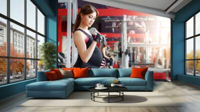 pregnant woman exercising in the gym Wall mural