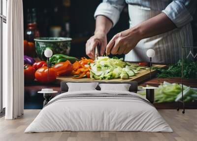 Cook slicing vegetables in a kitchen Wall mural