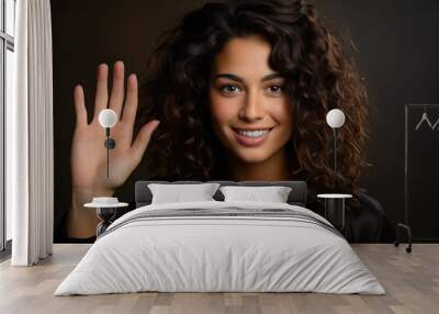 Playful waving hello gesture of a model - stock photography concepts Wall mural