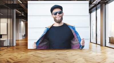 Hipster handsome male model with beard  wearing black blank t-shirt with space for your logo or design in casual urban style Wall mural